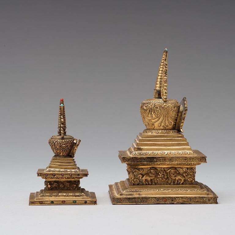 Two Tibetan gilt copper alloy stupa's, 19th Century.