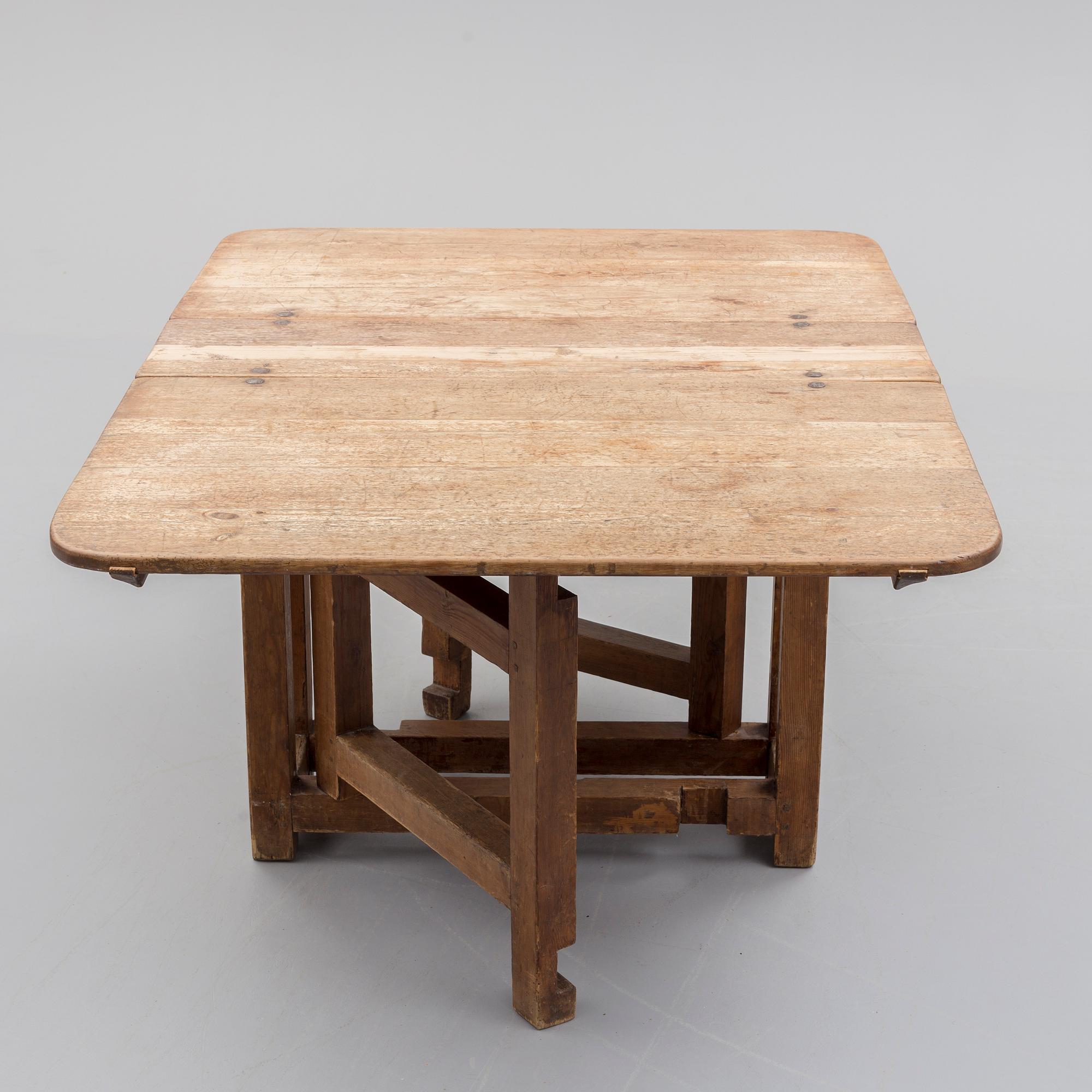 An 18th century gate leg table.