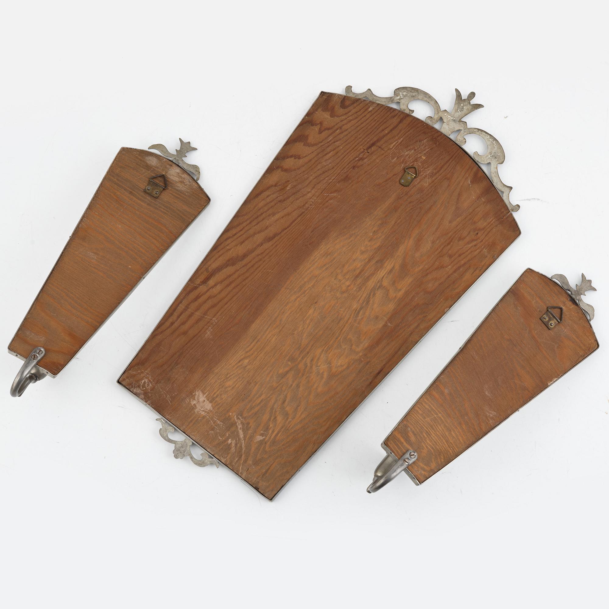 A Swedish Grace mirror and a pair of wall sconces, 1920's/30's.