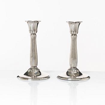 A pair of silver candle sticks, first half of the 20th century.