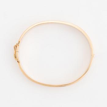 A 14K gold bracelet.