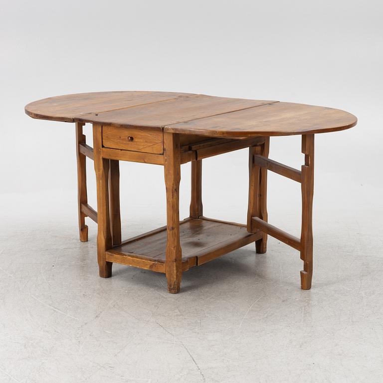An 19th century drop-leaf table.
