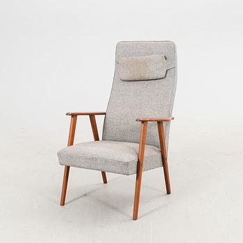 A 1960s teak armchair.