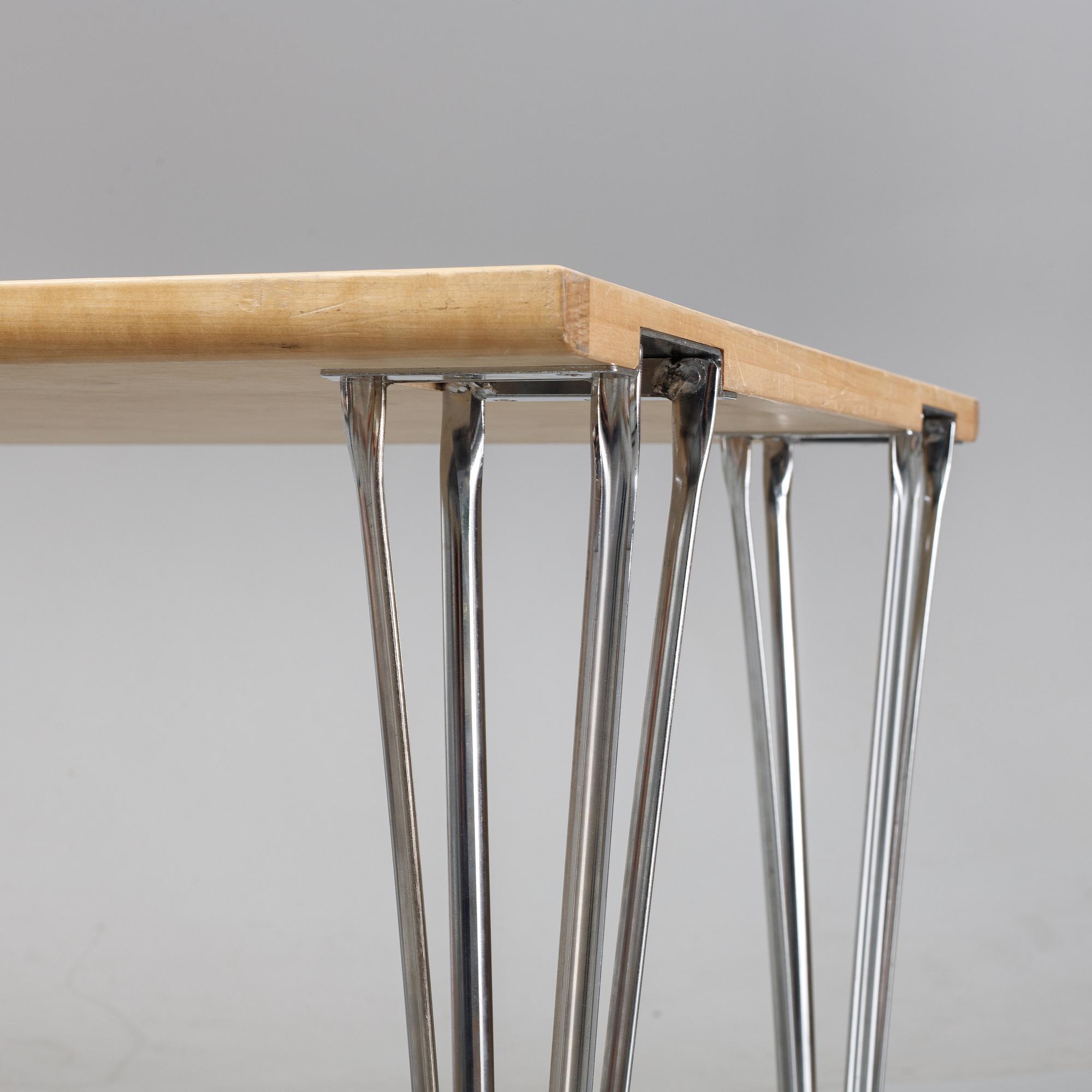 A birch and leather dining table produced by Mathsson International, 21th century.