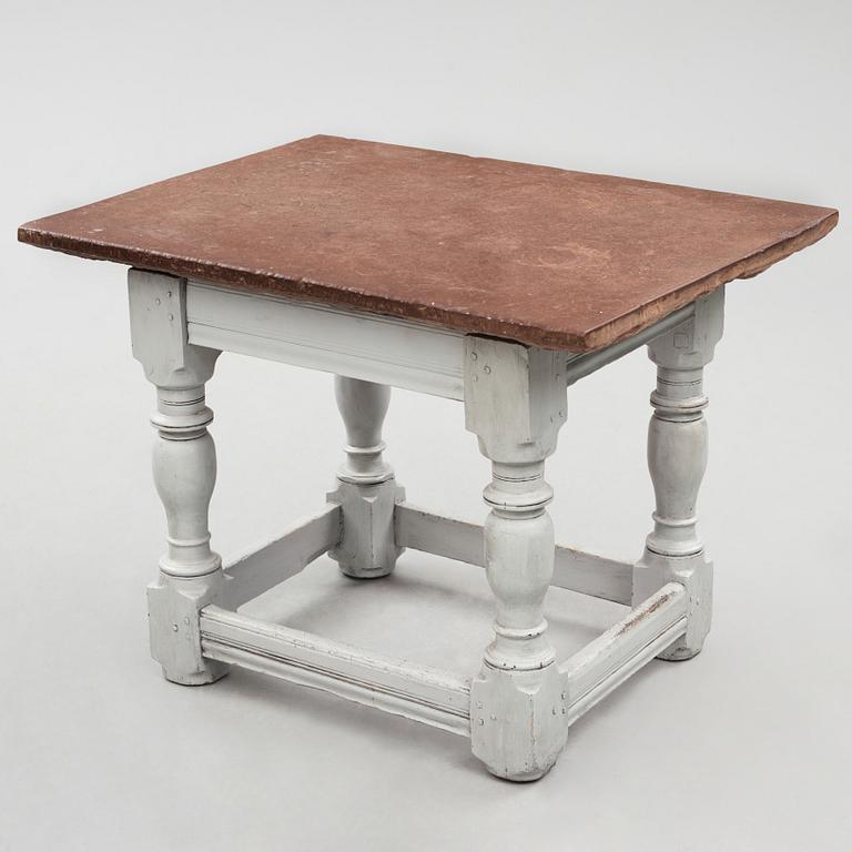 A limestone-top table, Sweden, 18th century.