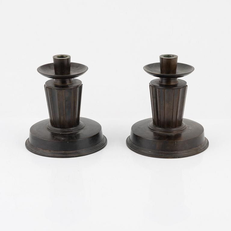 A pair of bronze candlesticks, 1920's-/30's.
