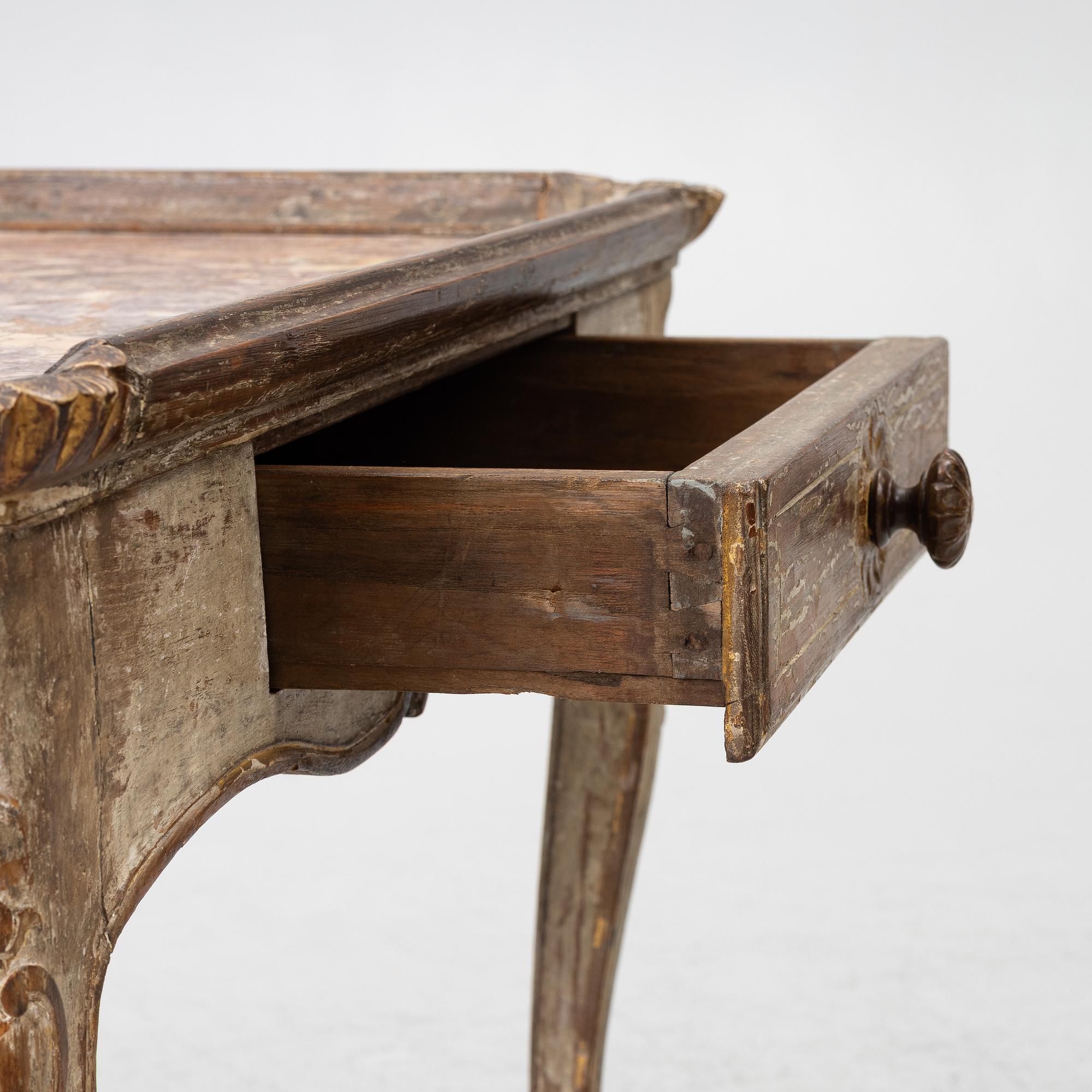 A Rococo table, 18th century.
