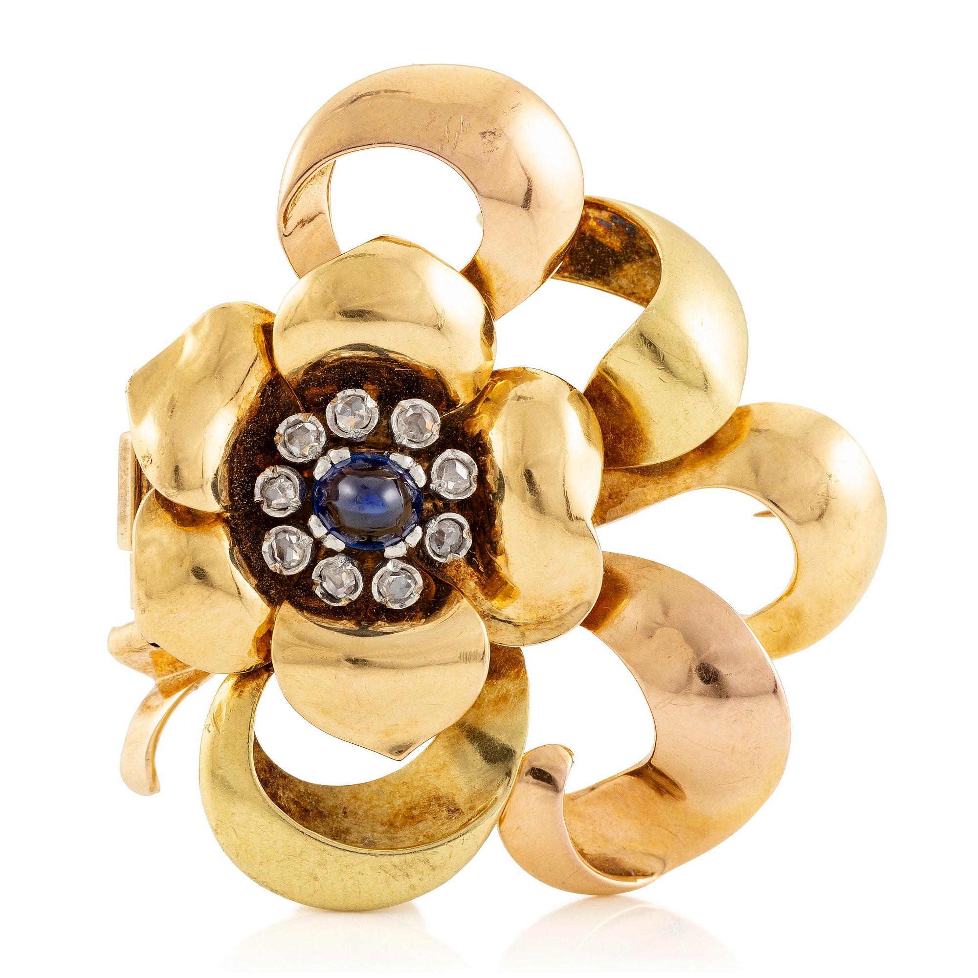 A W.A. Bolin brooch 18K gold with a cabochon-cut sapphire and rose-cut diamonds, Stockholm 1942.