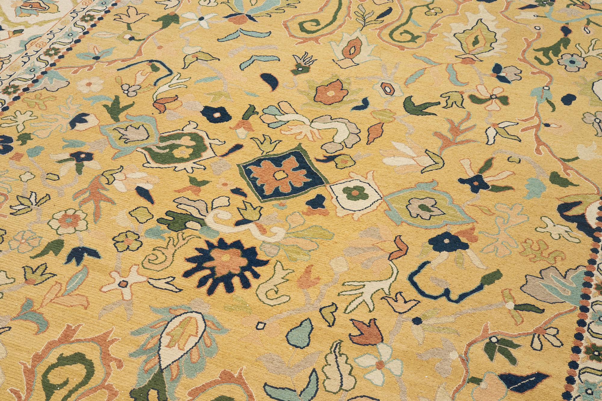 An Indian flat weave carpet of 'Shah Abbas' design, c. 402 x 289 cm.