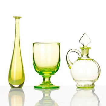 A glass bowl, a vase, a flacon, an ewer with stopper and a goblet, 20th century.