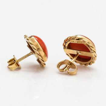 A pair of 18K gold earrings with coral.