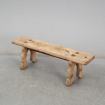 A 19th century folk art bench.