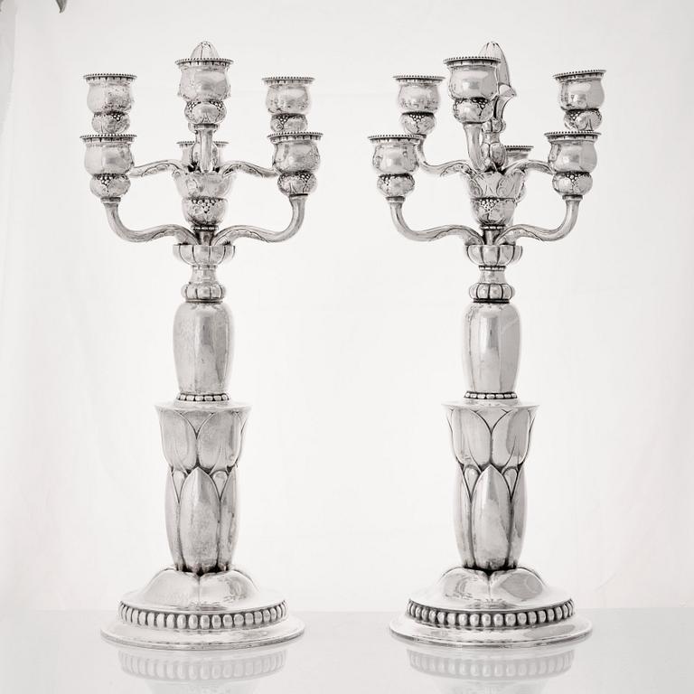 Georg Jensen, a pair of six lights silver candelabra, Copenhagen 1920, design nr 38.