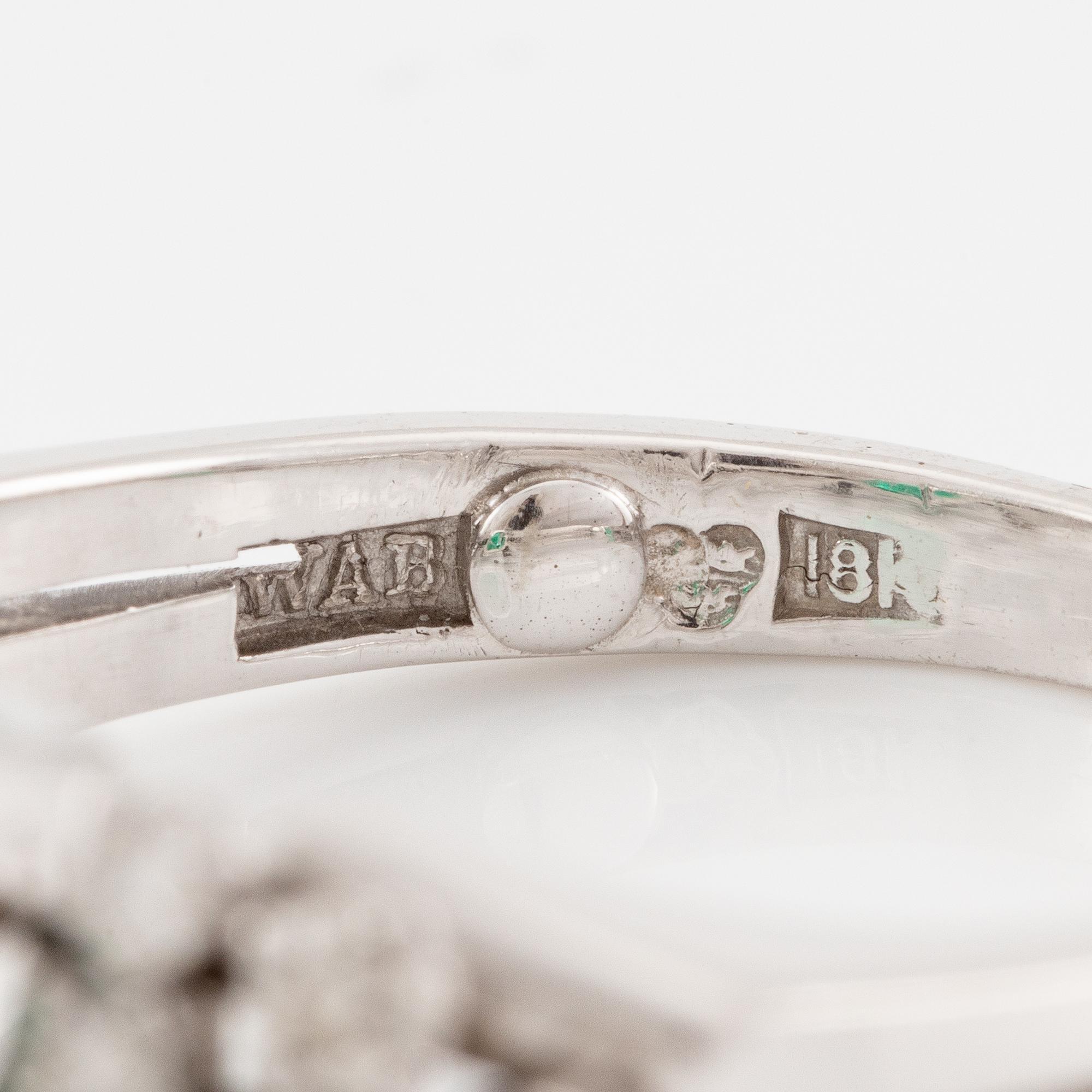 A W.A. Bolin ring 18K white gold with an emerald-cut emerald and brilliant-cut diamonds.