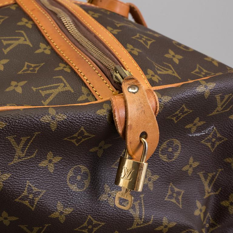 a LOUIS VUITTON "Sac Souple 55" weekend bag.