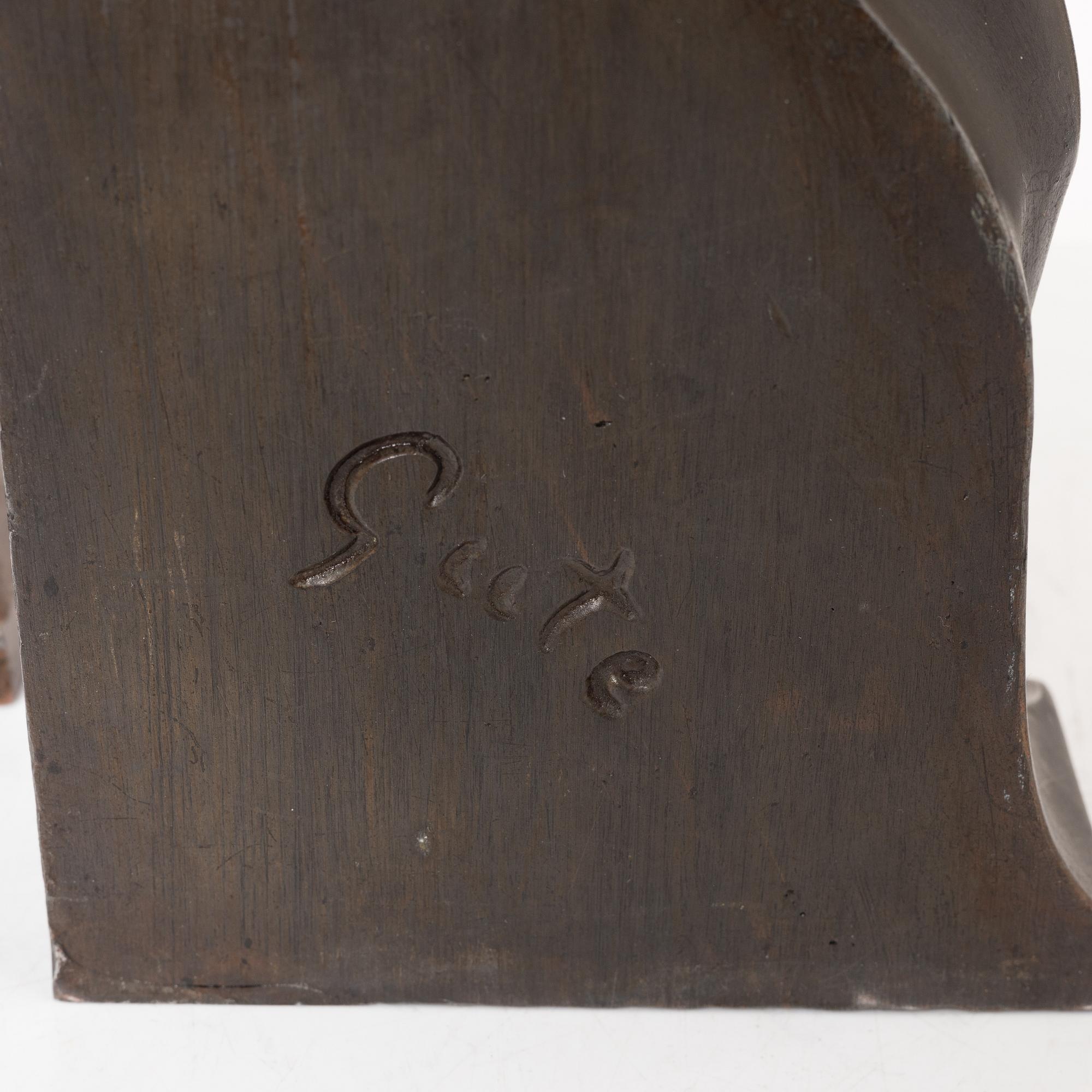 Axel Gute, two patinated metal bookends.