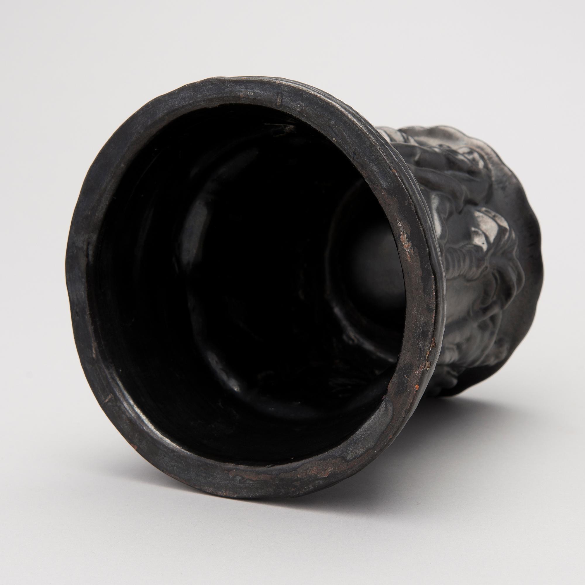 a plaster decoration bowl, signed Aarre Aaltonen 1923.