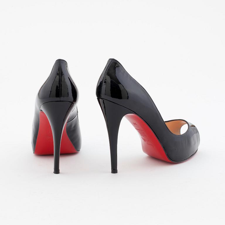 CHRISTIAN LOUBOUTIN, a pair of black patent leather pumps.