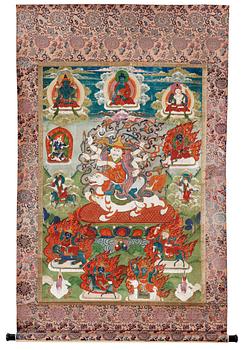 1314. A Tibetan or Mongolian thangka of Dorje Legpa on lion, surrounded by a Buddhist pantheon, presumably 19th Century.