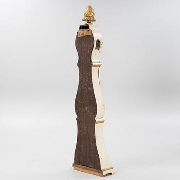 A long-case clock, 19th century.