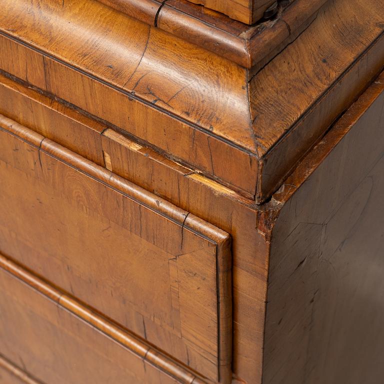 A late Baroque walnut-veneered cabinet in the manner of J. H. Fürloh, mid 18th century.