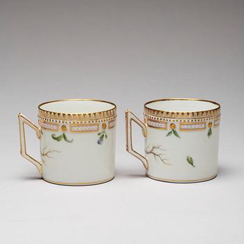 A pair of Royal Copenhagen "Flora Danica" coffee cups with stands, Denmark, 20th Century.