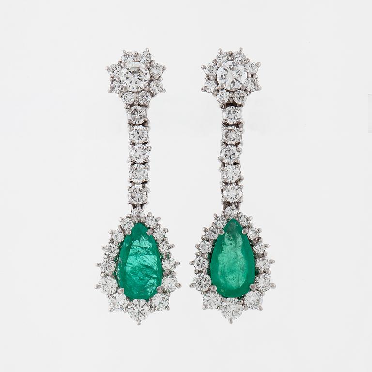 A pair of pear cut emerald and brilliant cut diamond earrings.