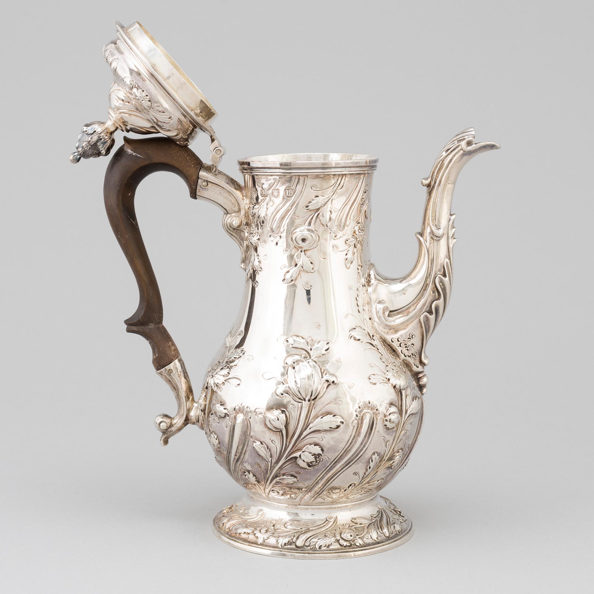 An English 18 th century silver coffee-pot, mark of Benjamin Gignac, London 1763.