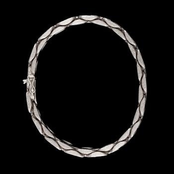 A white gold bracelet.