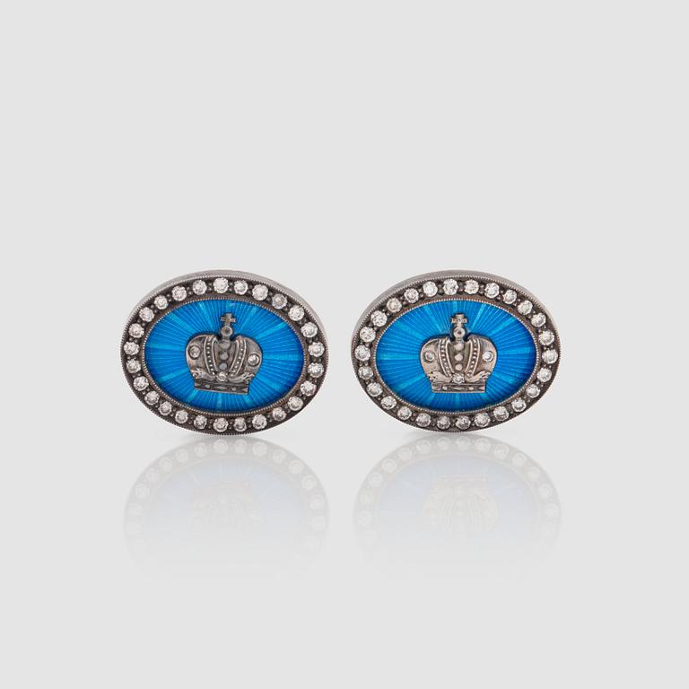 A pair of diamond and enamelled cufflinks. Total carat weight of diamonds circa 0.40 ct.