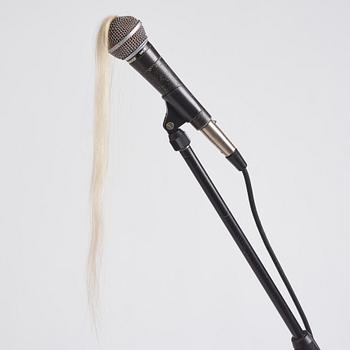 Leif Holmstrand, executed in 2009. Mic, hair, jeans fabric, thread, safety pins.