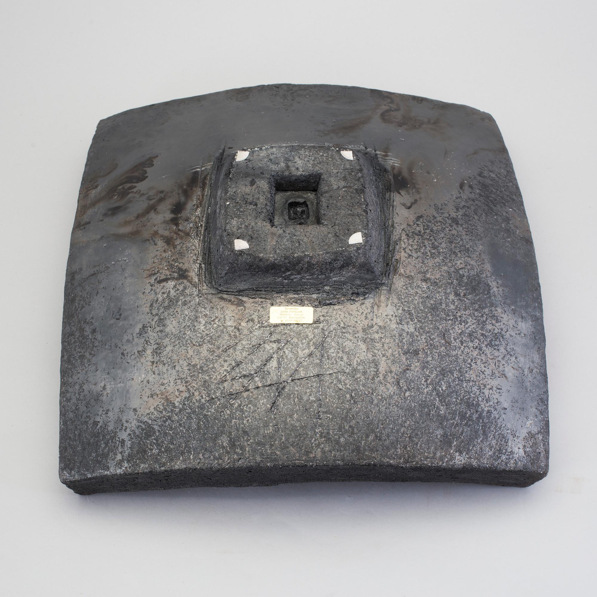 A barrel by LENA SVENSSON, raku burned pottery, sined.