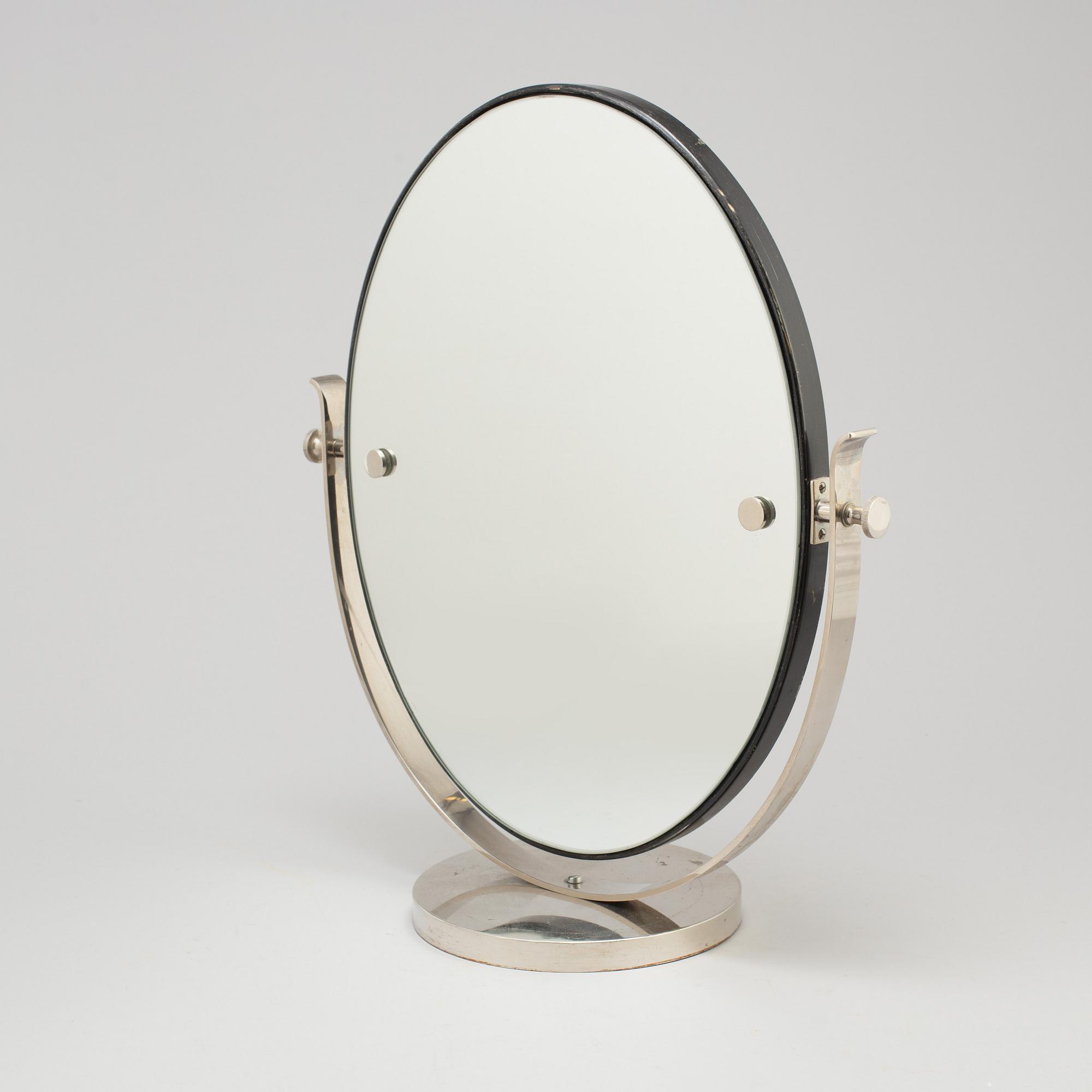 A 1930s art déco table mirror.