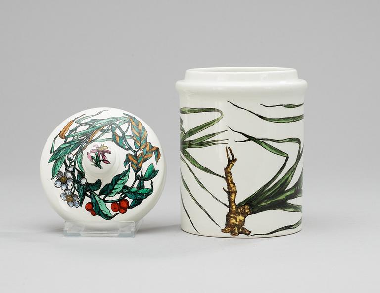 A Fornasetti porcelaine jar with lid.