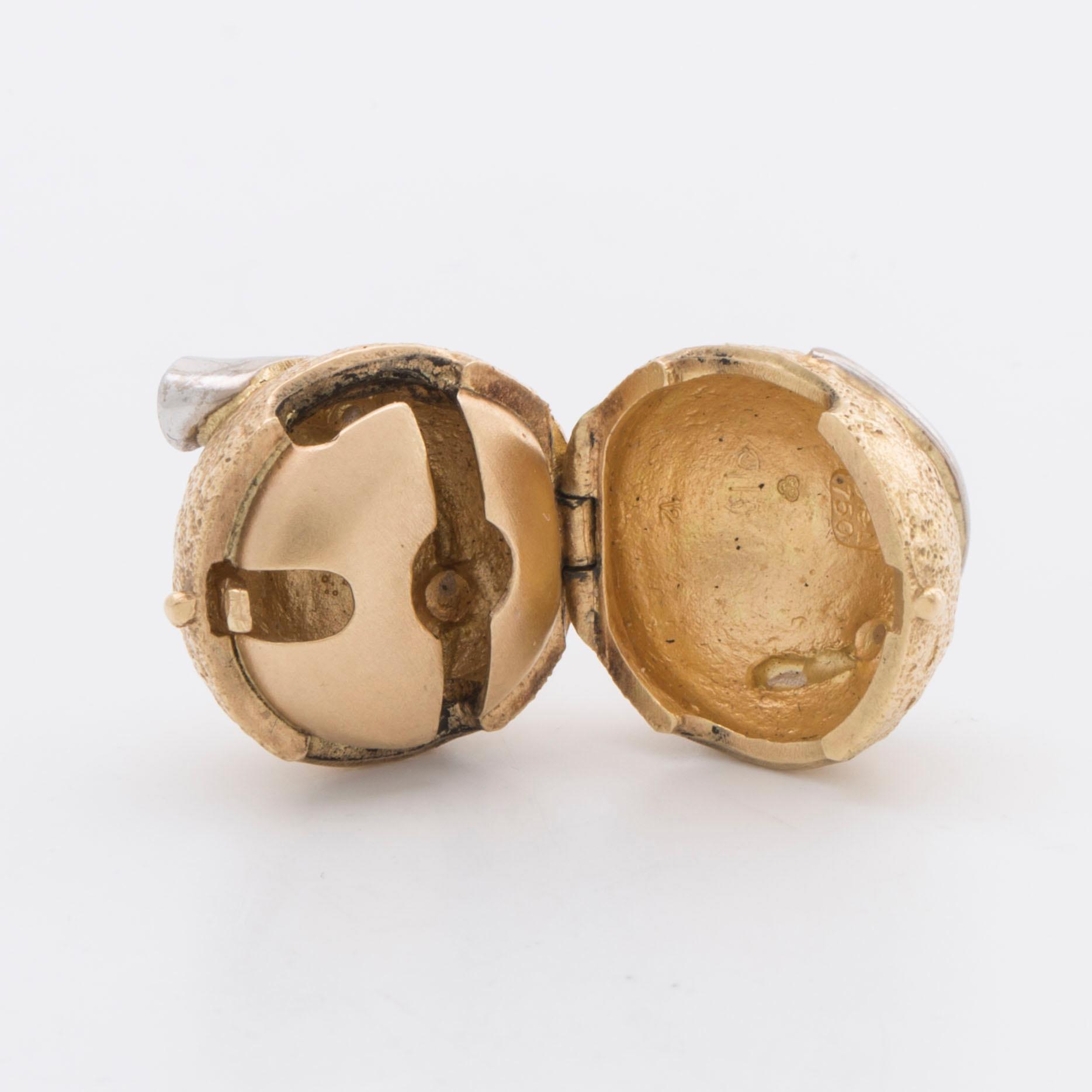 LYNGGAARD lås 18K guld och vitguld m 2 briljanter ca 0,10 ct totalt.
