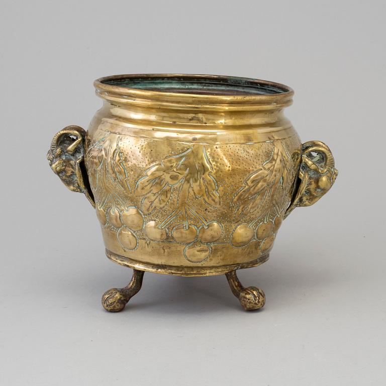 A 19TH CENTURY BRASS FLOWER POT.