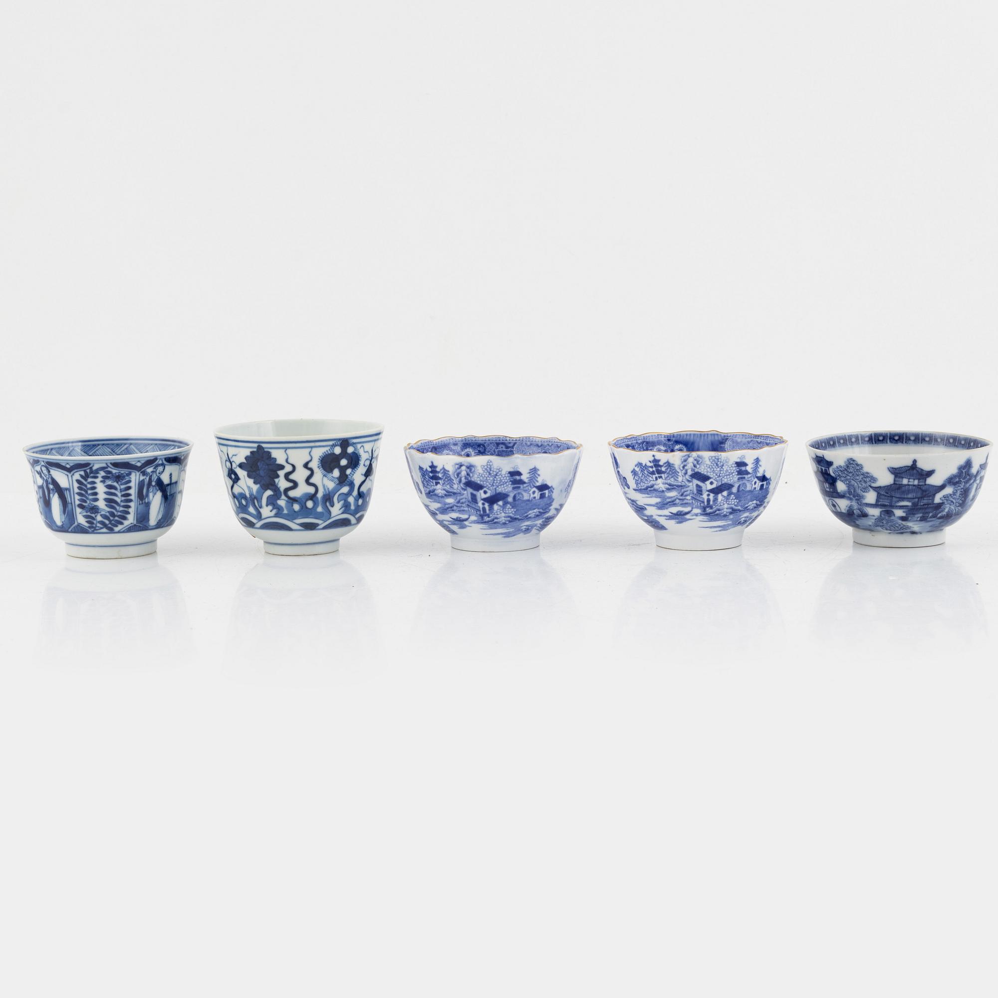 A group of thirteen cups, a bowl and a cup holder, four saucers, partly China and 18th century,