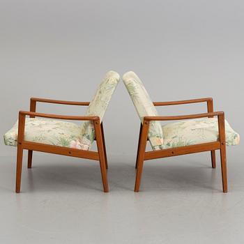 A pair of teak armchairs, 1960's.