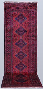 An Afghan runner, approximately 283 x 87 cm.