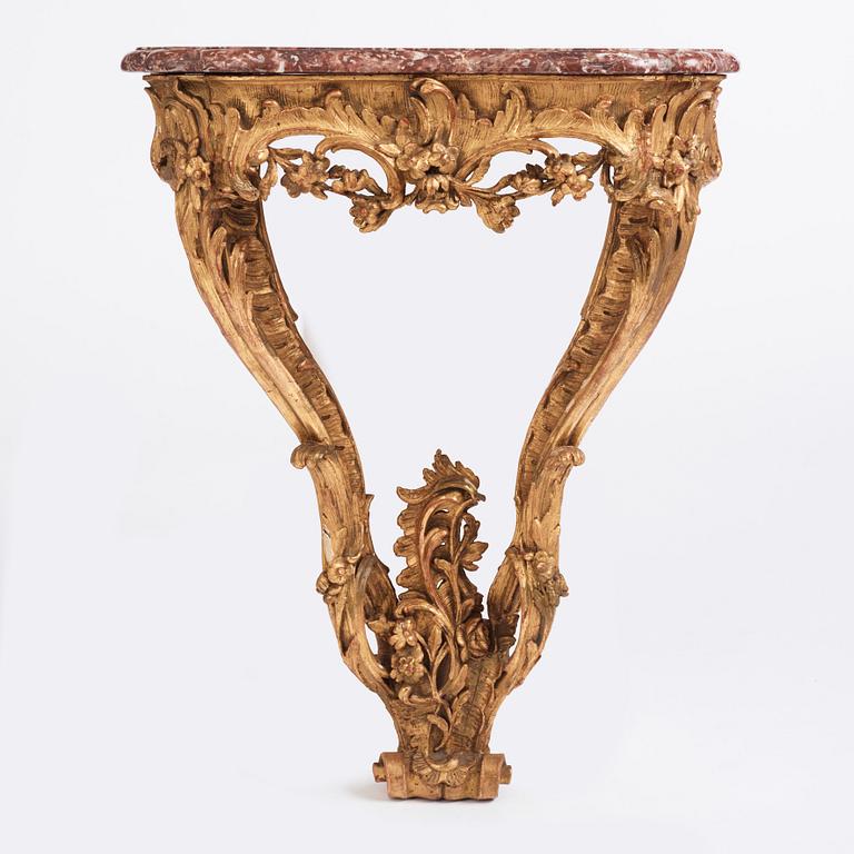 A Central European Louis XV carved and giltwood console table, mid 18th century.