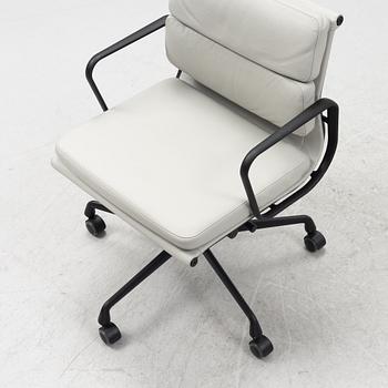 Charles & Ray Eames, a leather upholstered EA 217 soft pad office chair from VItra.