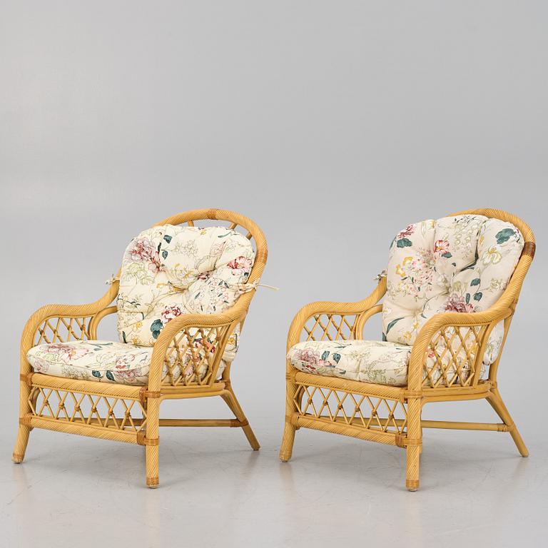 A rattan sofa and two armchairs, later part of the 20th century.