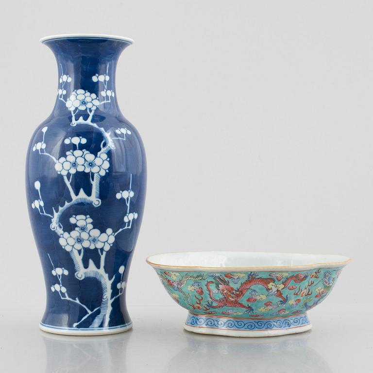 A Chinese porcelain dragon bowl, Qing dynasty, 19th century, and a blue and white porcelain vase, China, 20th century.