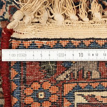 A Heris carpet, 305 x 205 cm.
