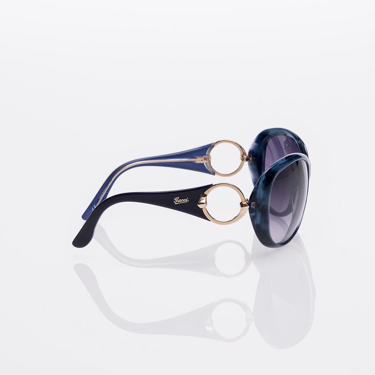 AURINKOLASIT, Gucci.