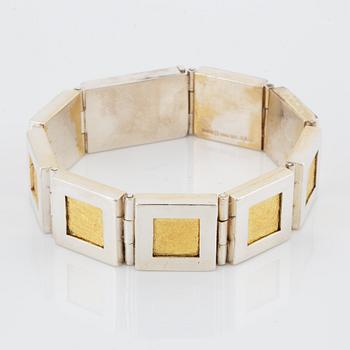 A Michael Hamma bracelet in silver and 18K gold.