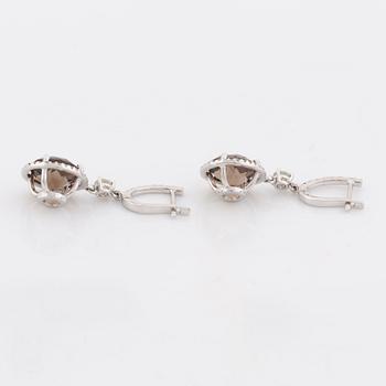 Smoky quartz and brilliant cut diamond earrings.