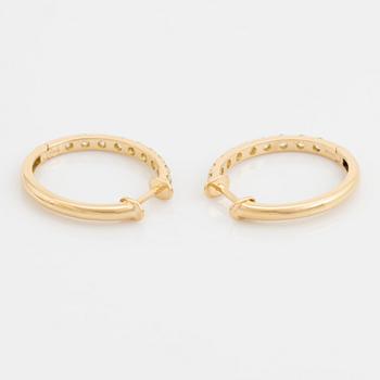 Brilliant cut diamond hoop earrings.