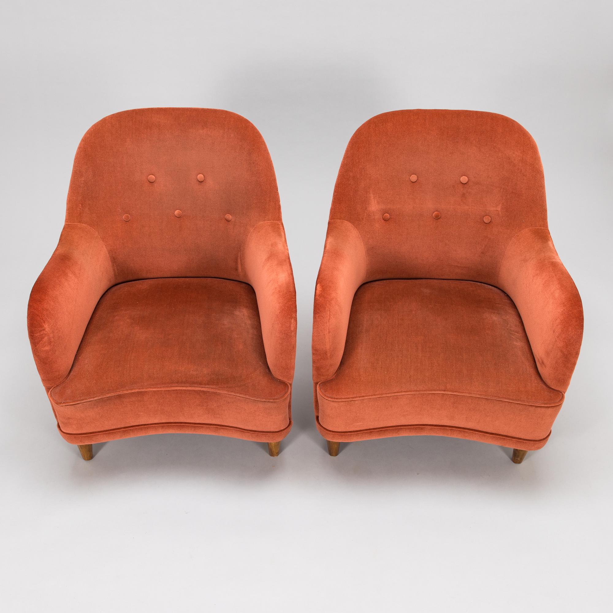 A pair of mid-20th-century armchairs.