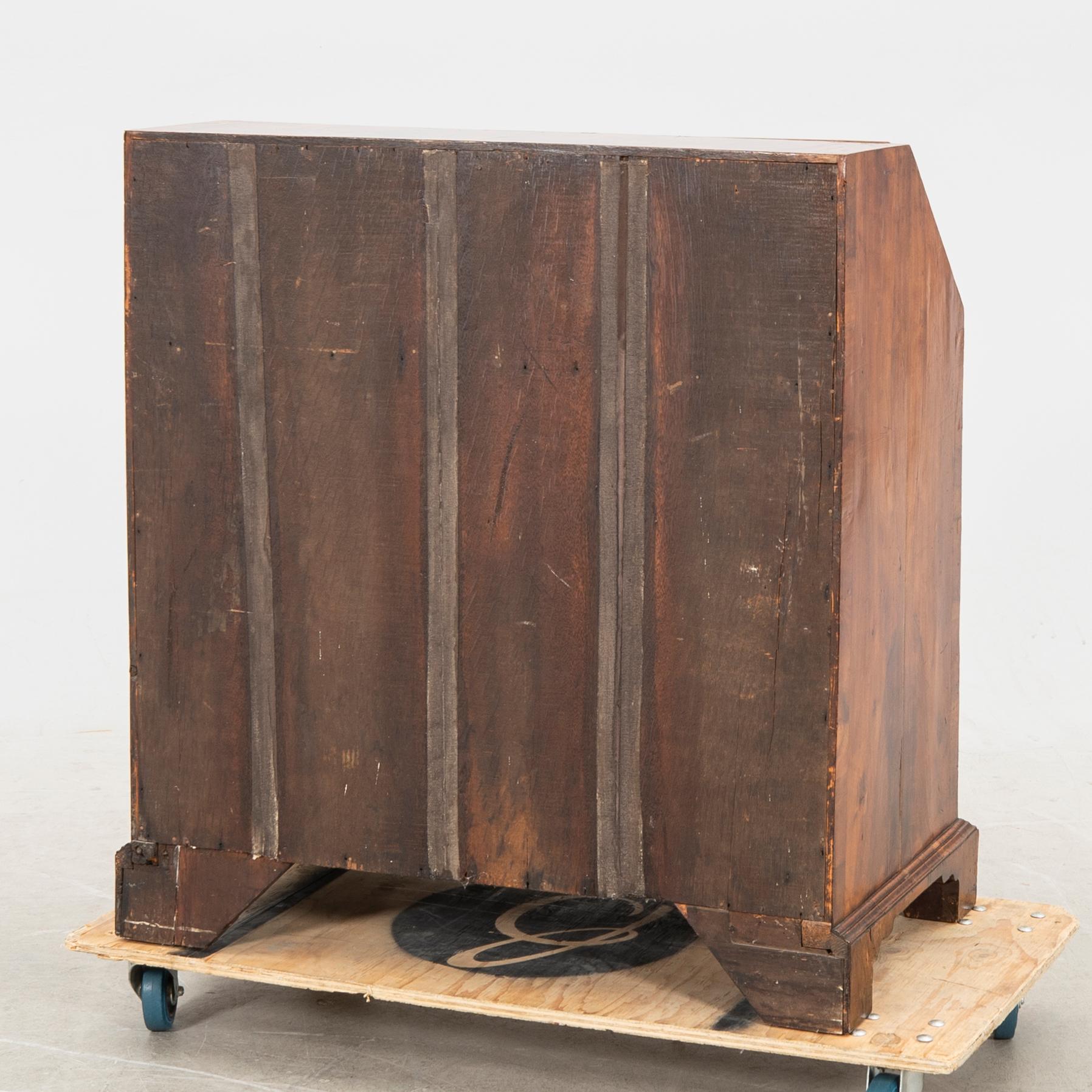 A walnut and mahogany writing bureau, mid-18th century late Baroque.